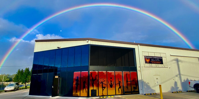 Double rainbow over gymnasium